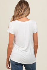 woman wearing a white short sleeve maternity top, viewed from the back with soft draping details