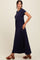 woman wearing a navy blue short sleeve maxi dress with a cinched waist and flowy skirt, standing sideways