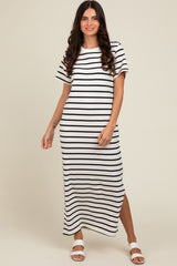 woman wearing a white and black striped maxi dress with short sleeves and a side slit