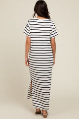 woman wearing a white and black striped maxi dress with short sleeves and side slits