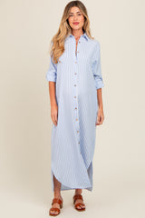 woman wearing a light blue and white striped maternity maxi dress with button front and rolled sleeves