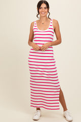 woman wearing a white and hot pink striped maxi dress with a side slit and a scoop neckline