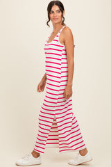 woman wearing a pink and white striped maxi dress with side slits and white sneakers