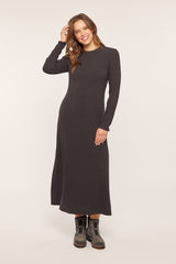 woman wearing a dark gray long sleeve ribbed maxi dress with a relaxed fit and black ankle boots