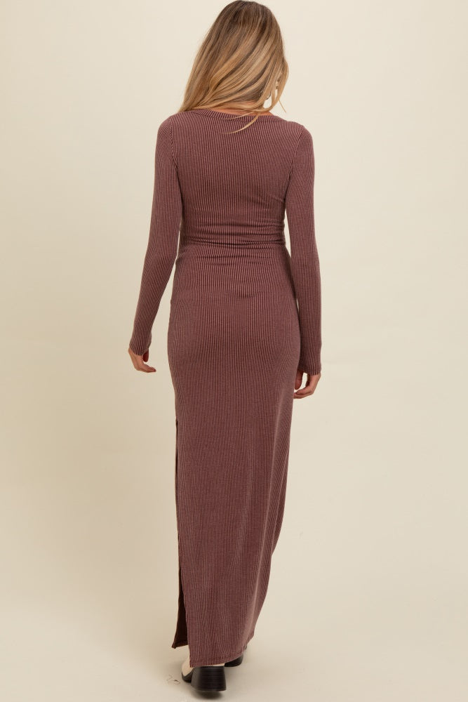 woman wearing a long brown ribbed maternity maxi dress with long sleeves and a side slit