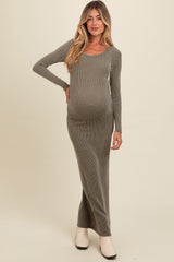 woman wearing a gray ribbed long sleeve maternity dress and showing her baby bump