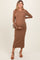 woman wearing a ribbed brown maternity dress and holding her baby bump