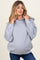 woman wearing a gray oversized maternity hoodie with a hood and dropped shoulders