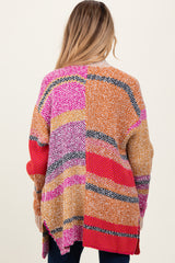woman wearing a multicolored maternity cardigan with a loose fit and long sleeves, showing the back view