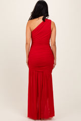 woman wearing a red one-shoulder ruched evening gown with a flowing skirt