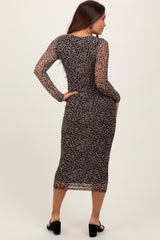 woman wearing a long sleeve leopard print maternity dress, showing a fitted silhouette and a back view
