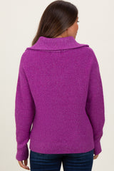 woman wearing a vibrant purple maternity sweater with a cowl neck and relaxed fit, seen from the back