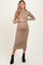 woman wearing a beige ribbed long sleeve maternity dress and holding her baby bump