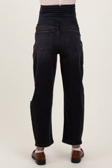woman wearing black maternity jeans with a high waistband, showing the back view