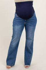 woman wearing dark blue maternity plus jeans with a wide waistband and a relaxed fit
