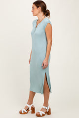 woman wearing a light blue ribbed midi dress with cap sleeves and side slits, styled with white platform sandals