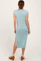 woman wearing a light blue ribbed midi dress with cap sleeves and a side slit, viewed from the back