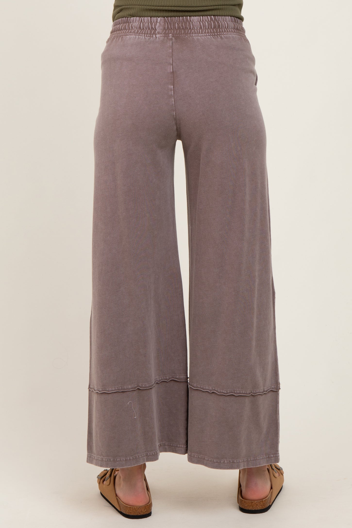 maternity wear lavender wide leg pants with a relaxed fit and elastic waistband, model shown from the back