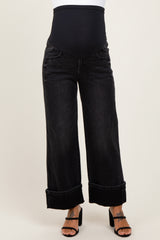 maternity wear black wide leg jeans with a supportive over-the-bump waistband, model wearing black high heel sandals