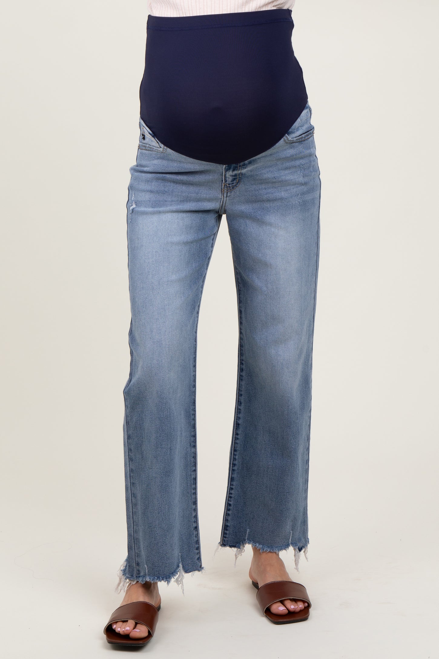 maternity wear light blue distressed wide-leg jeans with a stretchy navy maternity waistband