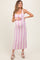 woman wearing a pink and white striped maternity dress and holding her baby bump