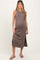 woman wearing a brown sleeveless maternity dress with side slits and a visible baby bump