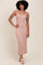 woman wearing a mauve striped sleeveless midi dress with a fitted silhouette and standing on a neutral background
