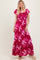 woman wearing a pink floral maxi dress with ruffled sleeves and a ruched bodice