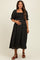 woman wearing a black floral maternity dress with smocked bodice and puff sleeves, showcasing her baby bump
