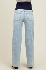 woman wearing light blue maternity jeans with a wide waistband, viewed from the back