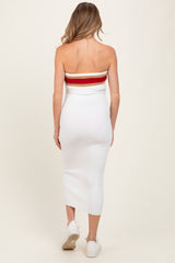 woman wearing a white ribbed maternity midi dress with a red and white striped bandeau top, showing a baby bump from the back