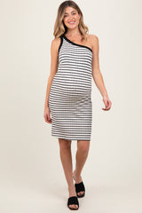 woman wearing a black and white striped maternity dress with one shoulder and a visible baby bump