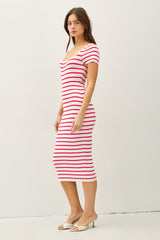 woman wearing a fitted midi dress with red and white stripes and short sleeves
