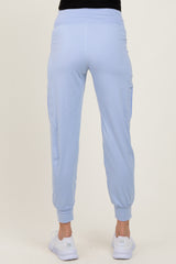 woman wearing light blue maternity jogger pants with side pockets and elasticized cuffs, seen from the back