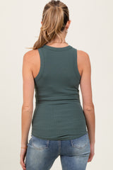 woman wearing a dark green ribbed maternity tank top, seen from the back with jeans