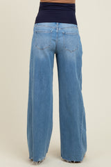 maternity wear light blue wide leg jeans with a high waistband showing a relaxed fit at the back
