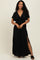 woman wearing a black maxi dress with a deep v-neck and side slits
