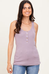 woman wearing a lavender ribbed tank top with button details and paired with blue jeans