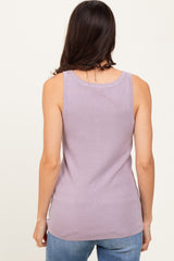 woman wearing a lavender sleeveless tank top, shown from the back, paired with light blue jeans