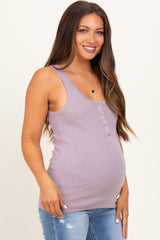 woman wearing a lavender maternity tank top with button details and a visible baby bump