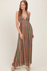 woman wearing a multicolored striped maxi dress with a halter neckline and a baby bump visible