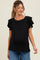 woman wearing a black maternity top with ruffled sleeves and a visible baby bump