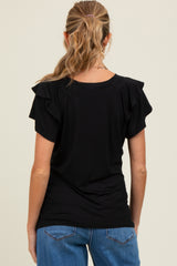 woman wearing a black short sleeve maternity top with ruffle sleeves, viewed from the back