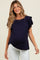 woman wearing a navy blue maternity top with ruffled sleeves and a visible baby bump