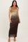 woman wearing a sleeveless ombre maxi dress in shades of brown and green, standing on a neutral background