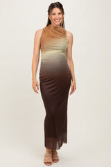 woman wearing a sleeveless ombre maternity maxi dress in shades of brown and green, highlighting her baby bump