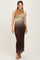 woman wearing a sleeveless ombre maternity maxi dress in shades of brown and green, highlighting her baby bump