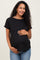 woman wearing a black short sleeve maternity top and holding her baby bump