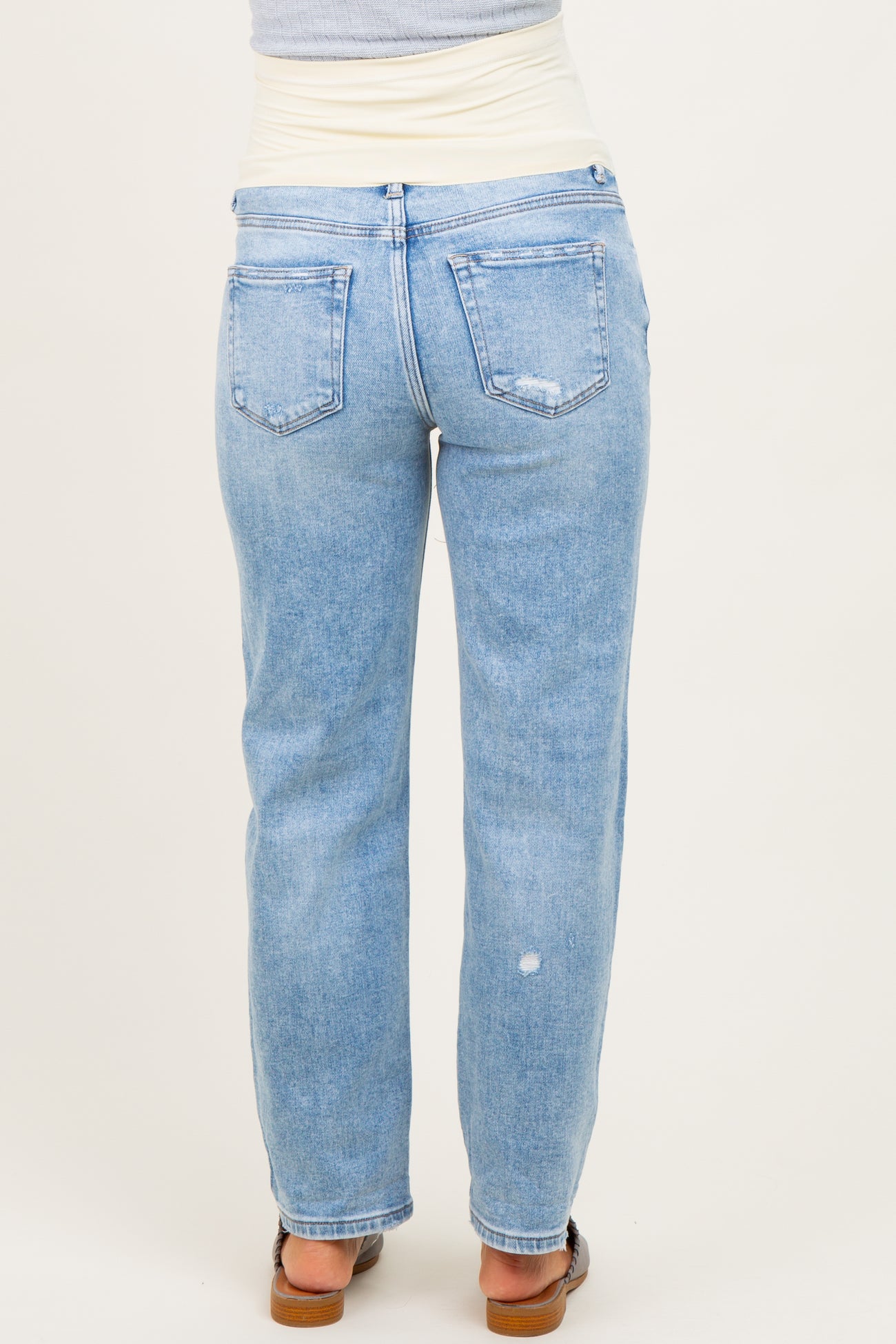 light blue maternity jeans with a stretchy waistband, shown from the back