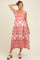 woman wearing a red and white floral print maternity dress with short sleeves and a square neckline